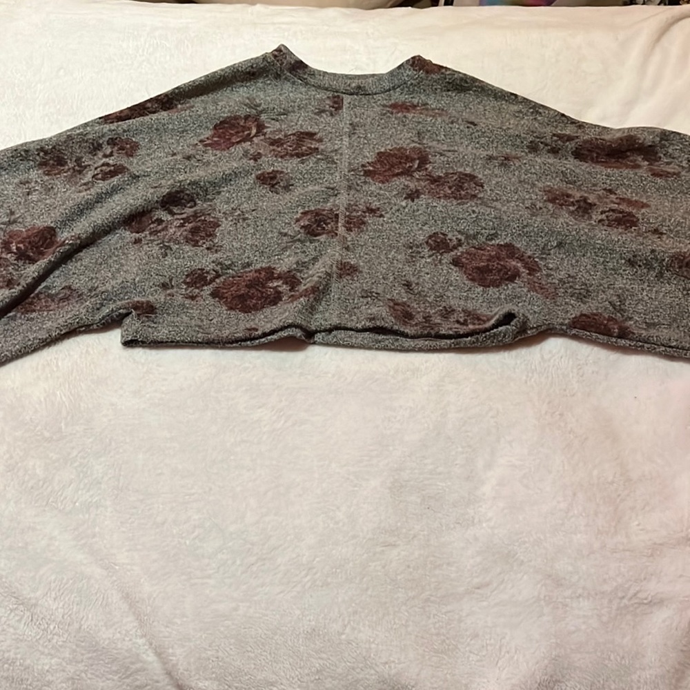 Long sleeved top with red floral patterns